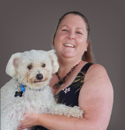 Faith Christian School teacher Jasmine Parnell holding her dog in her arms